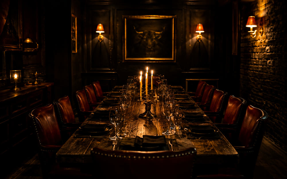 Long table set for a private dinner in The Cellar