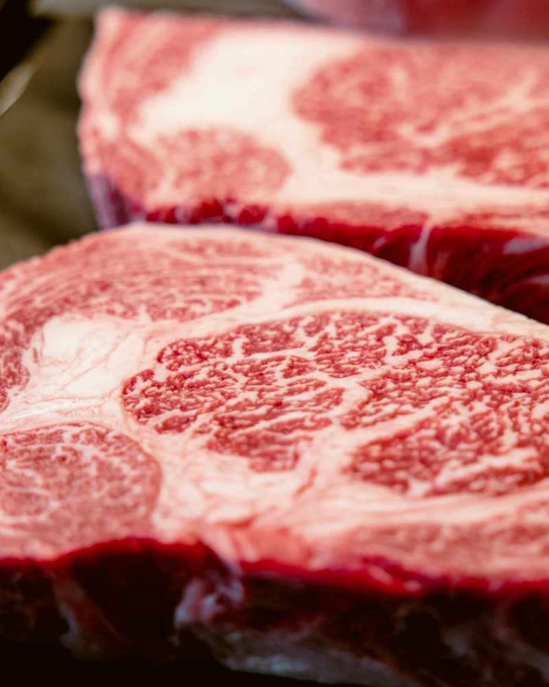 Marbled bone-in ribeye steak